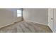 Comfortable carpeted bedroom featuring natural light from the window and neutral walls at 11144 Echo Trl, Indianapolis, IN 46236