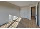 Bedroom featuring neutral walls, carpet flooring, and double door closet with sunlight streaming in at 11144 Echo Trl, Indianapolis, IN 46236