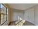 Bedroom with neutral paint, carpet flooring, double-door closet, and a window offering natural light at 11144 Echo Trl, Indianapolis, IN 46236