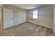 Cozy bedroom with carpet, a double closet, and plenty of natural light from the window at 11144 Echo Trl, Indianapolis, IN 46236