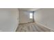 Neutral bedroom with a window for natural light, carpet flooring, and a closet at 11144 Echo Trl, Indianapolis, IN 46236