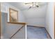 Hallway view to carpeted bonus room with neutral paint and natural lighting at 1146 Mount Vernon Dr, Greenwood, IN 46142