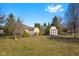 Fenced backyard featuring outbuildings, providing secure storage and enhancing the property's functionality and appeal at 1146 Mount Vernon Dr, Greenwood, IN 46142
