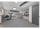 Finished basement with exercise equipment and carpeted floors, providing ample space for recreation and fitness at 1146 Mount Vernon Dr, Greenwood, IN 46142