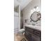 Well-lit bathroom with a granite vanity, a decorative mirror, and a shower-tub combo at 1146 Mount Vernon Dr, Greenwood, IN 46142