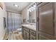 Bathroom featuring a vanity, toilet, medicine cabinet and shower with a gray curtain at 1146 Mount Vernon Dr, Greenwood, IN 46142