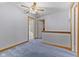 Neutral bedroom featuring a ceiling fan, blue carpet, and white trim at 1146 Mount Vernon Dr, Greenwood, IN 46142