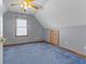 Cozy bedroom with slanted ceilings, neutral paint, and a ceiling fan at 1146 Mount Vernon Dr, Greenwood, IN 46142