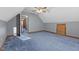 Carpeted bedroom featuring a ceiling fan and access to another room at 1146 Mount Vernon Dr, Greenwood, IN 46142