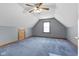 Spacious bedroom with angled ceiling, a ceiling fan, and natural light at 1146 Mount Vernon Dr, Greenwood, IN 46142