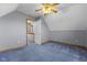 Gray bedroom with neutral carpet, slanted ceilings, and a double door closet at 1146 Mount Vernon Dr, Greenwood, IN 46142