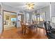 Charming dining area with a wooden table, chairs, hardwood floors, and views of the adjacent living space at 1146 Mount Vernon Dr, Greenwood, IN 46142
