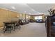 Spacious living room featuring a brick wall, neutral carpeting and seating at 1146 Mount Vernon Dr, Greenwood, IN 46142