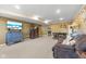 Spacious living room featuring a brick wall, neutral carpeting and comfortable seating at 1146 Mount Vernon Dr, Greenwood, IN 46142