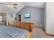 Main bedroom featuring a wood-frame bed, ceiling fan, and a wall-mounted television at 1146 Mount Vernon Dr, Greenwood, IN 46142