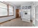 Bright mudroom featuring a bench with hooks, a window, and a neutral color scheme at 1146 Mount Vernon Dr, Greenwood, IN 46142