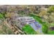 Aerial view of a beautiful home with a lush green lawn, mature trees, and inviting pool area at 11796 Sycamore St, Zionsville, IN 46077