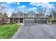 Charming two-story home with a three-car garage and inviting front porch, perfect for relaxing and enjoying the outdoors at 11796 Sycamore St, Zionsville, IN 46077