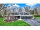 Beautiful home with a three-car garage, well-manicured lawn, and lovely landscaping, exuding curb appeal at 11796 Sycamore St, Zionsville, IN 46077
