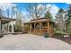Charming wooden gazebo featuring ample space for dining and grilling with an outdoor kitchen at 11796 Sycamore St, Zionsville, IN 46077