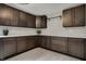 Modern kitchenette with plenty of cabinet space, drawers, and sleek countertops at 11796 Sycamore St, Zionsville, IN 46077