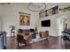 Cozy living room with high ceilings, unique lighting, comfortable leather seating, and a grand piano at 11796 Sycamore St, Zionsville, IN 46077