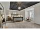 Elegant main bedroom featuring a trey ceiling, decorative chandelier, and neutral colors at 11796 Sycamore St, Zionsville, IN 46077