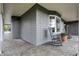 Inviting covered porch featuring stone flooring and classic rocking chairs, perfect for outdoor relaxation at 11796 Sycamore St, Zionsville, IN 46077