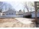 Backyard with garage, driveway and partial fence at 1622 N Linwood Ave, Indianapolis, IN 46218