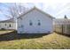 Siding and windows on home's exterior with grassy backyard at 1622 N Linwood Ave, Indianapolis, IN 46218