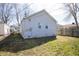 Backyard view of home featuring siding and windows plus grassy yard at 1622 N Linwood Ave, Indianapolis, IN 46218