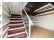 Basement staircase with access to an unfinished storage space at 1622 N Linwood Ave, Indianapolis, IN 46218