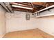 Unfinished basement featuring exposed ceiling and block wall construction at 1622 N Linwood Ave, Indianapolis, IN 46218