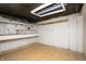 Unfinished basement with block walls, shelving, and exposed ceiling at 1622 N Linwood Ave, Indianapolis, IN 46218