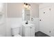 White bathroom featuring modern fixtures, gray walls and white tiles at 1622 N Linwood Ave, Indianapolis, IN 46218