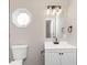 A serene bathroom featuring a vanity, mirror, and a stylish light fixture at 1622 N Linwood Ave, Indianapolis, IN 46218