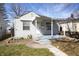 A beautifully presented home with a charming front porch and well kept garden at 1622 N Linwood Ave, Indianapolis, IN 46218