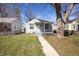 Charming home featuring a well-maintained lawn, sidewalk, and inviting front porch at 1622 N Linwood Ave, Indianapolis, IN 46218