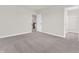 Bedroom featuring gray carpet, white trim, and neutral colored walls with stairway view at 16429 Mount Logan Rd, Noblesville, IN 46060