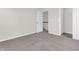 This bedroom features neutral walls, carpeted floor, and an open closet, offering a clean and adaptable space at 16429 Mount Logan Rd, Noblesville, IN 46060