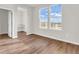 Sun-filled bedroom with hard wood flooring and a walk-in closet at 16429 Mount Logan Rd, Noblesville, IN 46060