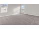 Sunlit carpeted bedroom with multiple windows, neutral walls, and electrical outlets to accommodate your needs at 16429 Mount Logan Rd, Noblesville, IN 46060