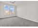 Carpeted bedroom with neutral paint, two large windows to let in lots of light and electrical outlets on each wall at 16429 Mount Logan Rd, Noblesville, IN 46060
