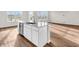 Bright, open kitchen with white cabinets and a kitchen island at 16429 Mount Logan Rd, Noblesville, IN 46060