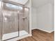Tiled shower featuring glass door and tiled walls with window allowing natural light at 16429 Mount Logan Rd, Noblesville, IN 46060