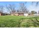 Expansive backyard with a pergola-covered patio, perfect for outdoor entertaining and relaxation at 1721 Rachel Dr, Plainfield, IN 46168