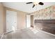 This bedroom features plush carpeting, an attached bathroom, and an accent wall at 1721 Rachel Dr, Plainfield, IN 46168