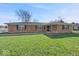 Charming single-story brick home featuring a well-maintained lawn and mature tree at 1721 Rachel Dr, Plainfield, IN 46168