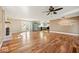 Spacious living room featuring hardwood floors, stainless steel refrigerator and fireplace at 1721 Rachel Dr, Plainfield, IN 46168