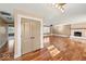 Bright and airy living room with hardwood floors and a cozy brick fireplace at 1721 Rachel Dr, Plainfield, IN 46168